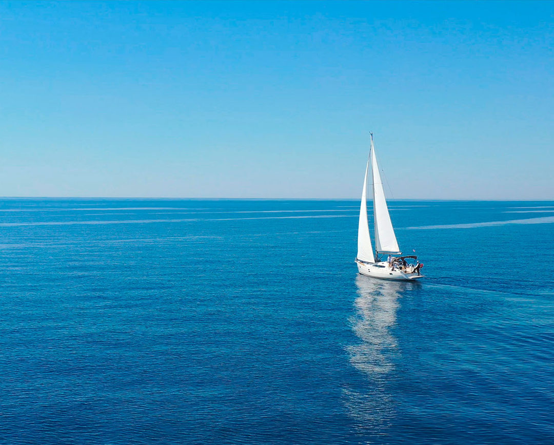 Sailboat on a bright blue sea