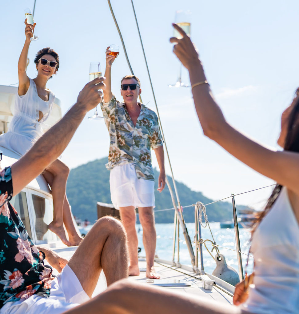 Members toasting aboard a yacht